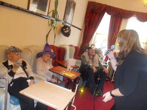 residents enjoying a group activity of entertainment and singing as they chose to